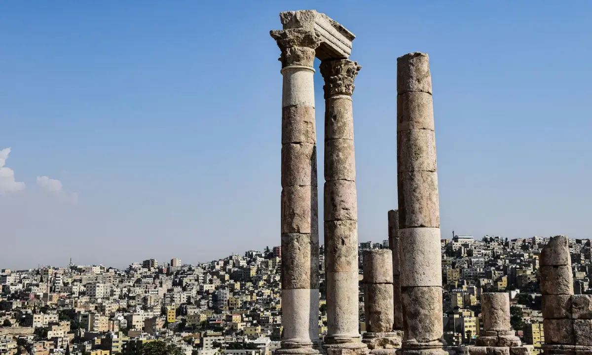 Historic columns at the Amman Citadel with the city beyond