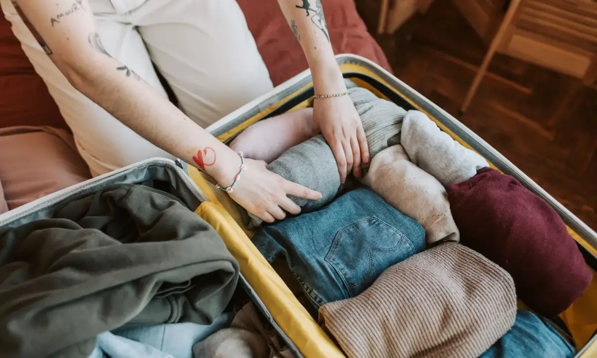 Packing clothes into a suitcase