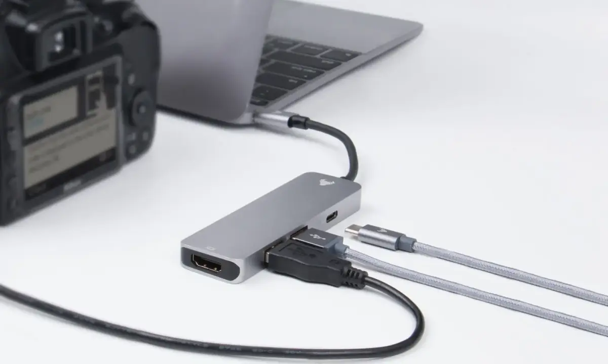 A laptop and camera with connected cables
