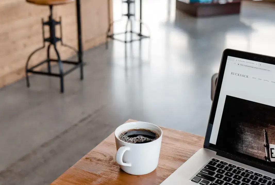 Coffee, a laptop and a journal