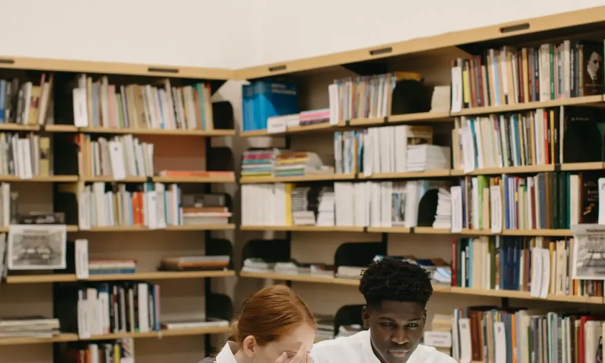 Students working at a library desk