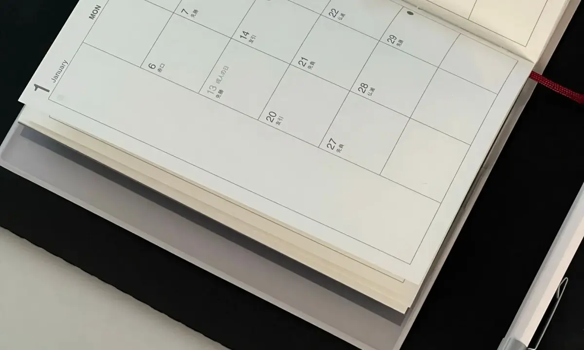 A calendar and notebook for planning
