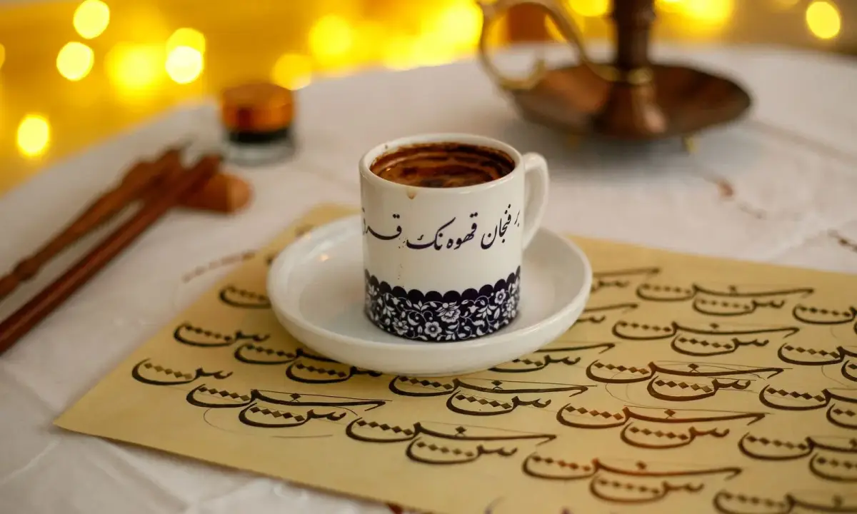 A small coffee cup on a decorated table