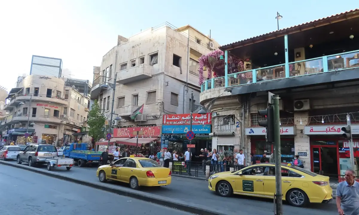 A yellow taxi on King Faisal Street in Amman, photographed in 2021.