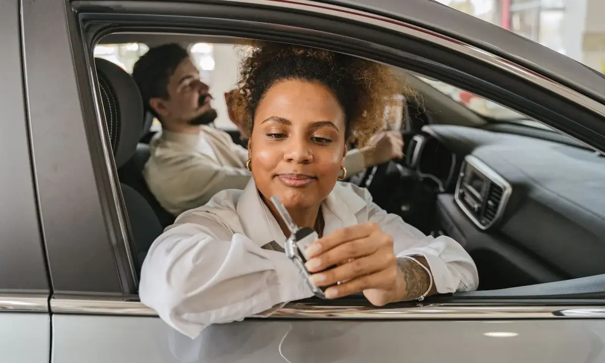 A driver holding car keys
