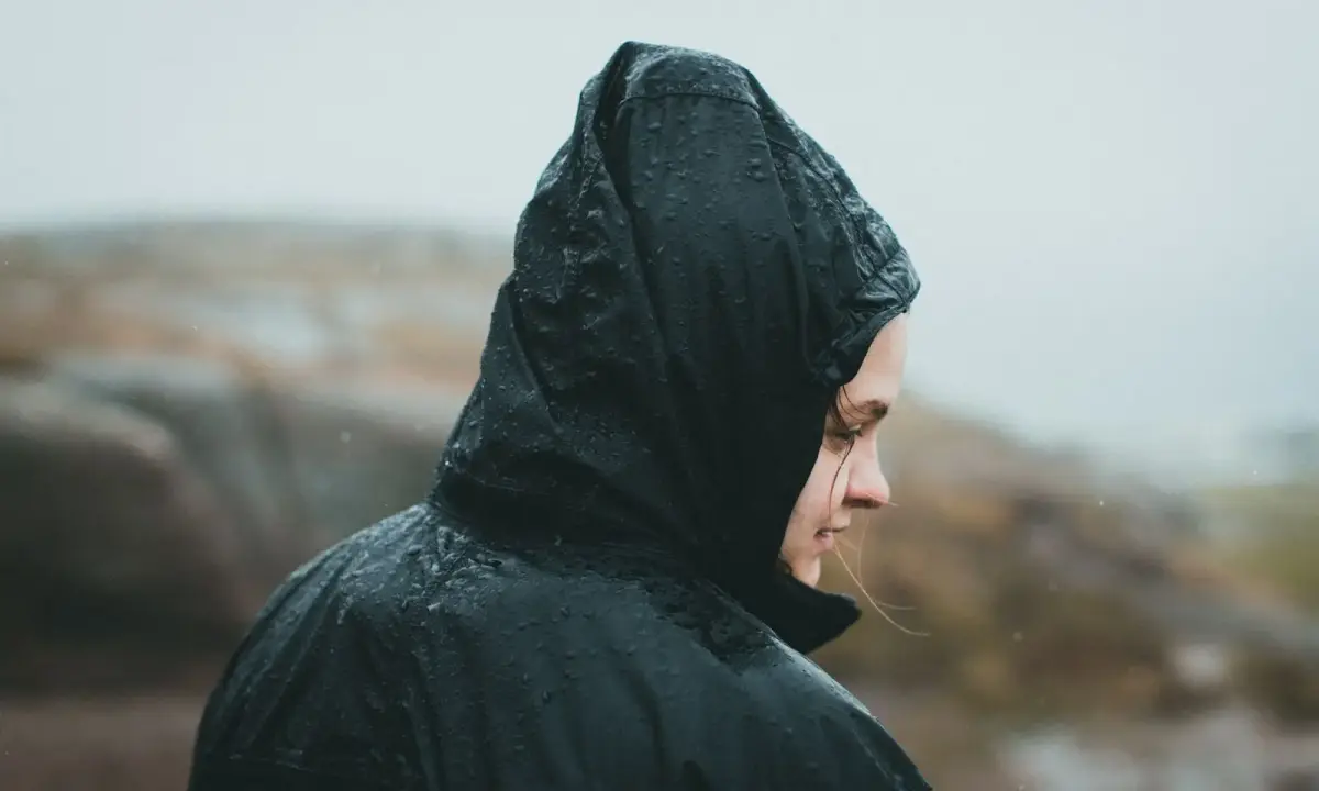 A waterproof jacket worn in the rain