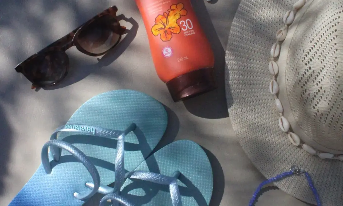 Hat, sunglasses and sunscreen for warm weather