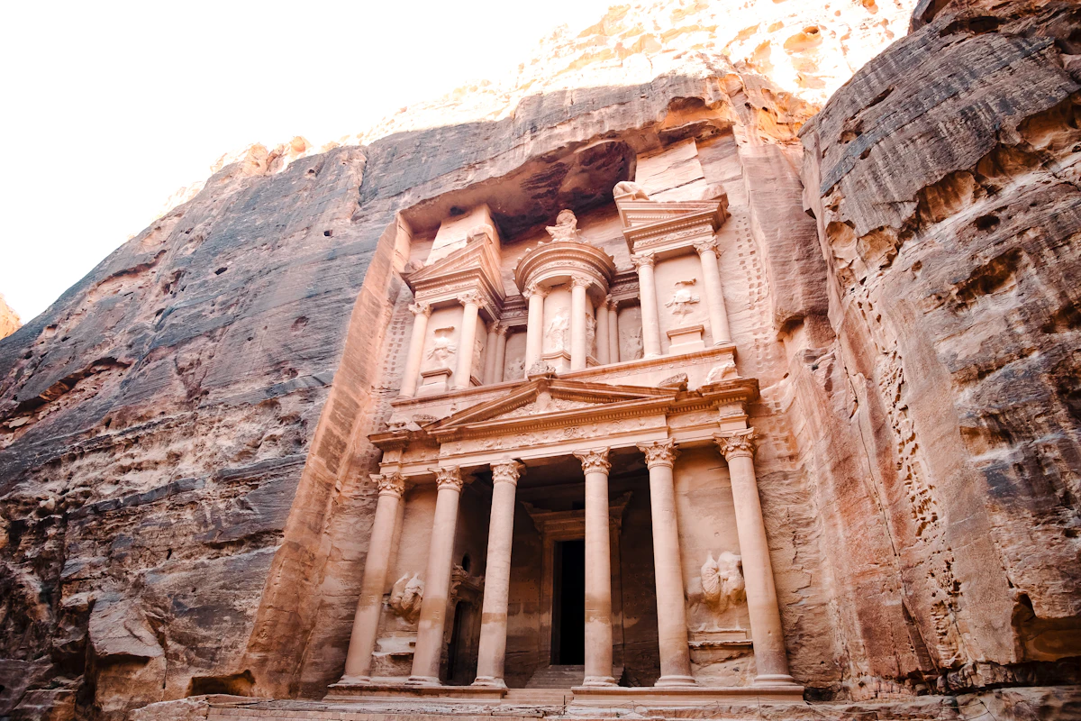 The Treasury carved into the sandstone cliffs at Petra
