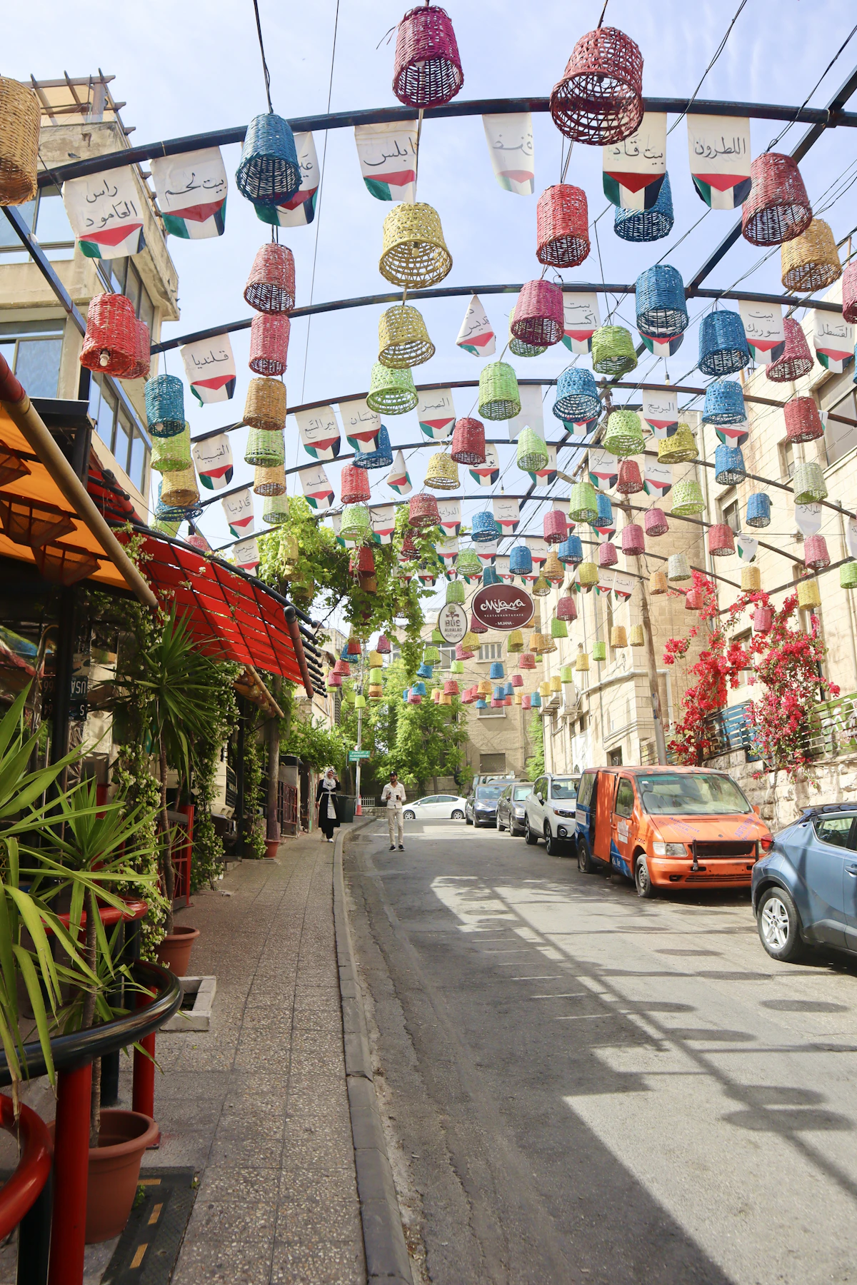 Colourful decorations hanging above Rainbow Street in Amman
