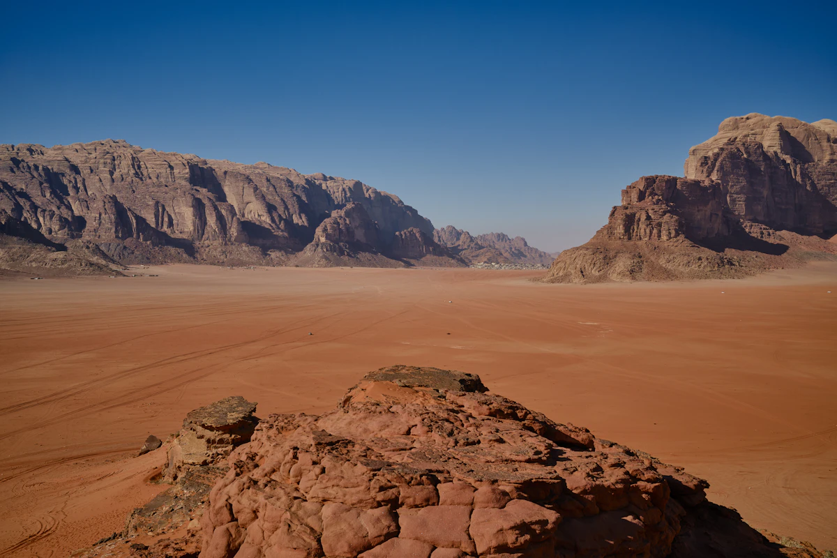 Sandstone mountains above the red desert in Wadi Rum